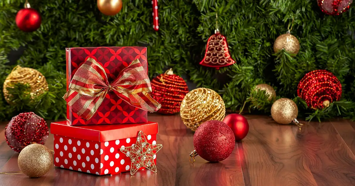Christmas gift hamper with sweets and wrapped presents packed for international courier from Hyderabad to UK and USA