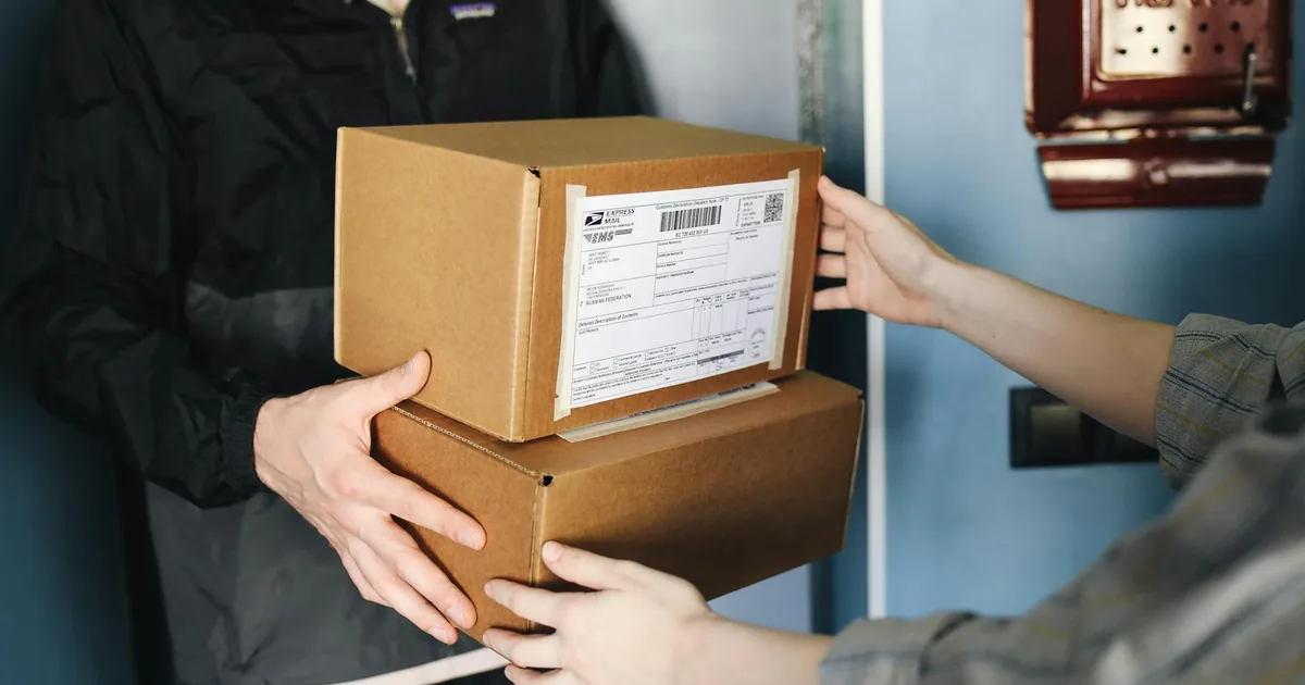 Hyderabad online seller packing Etsy orders into export cartons for international DHL courier to USA and UK buyers